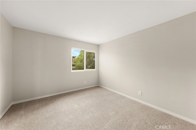 unfurnished room featuring carpet floors