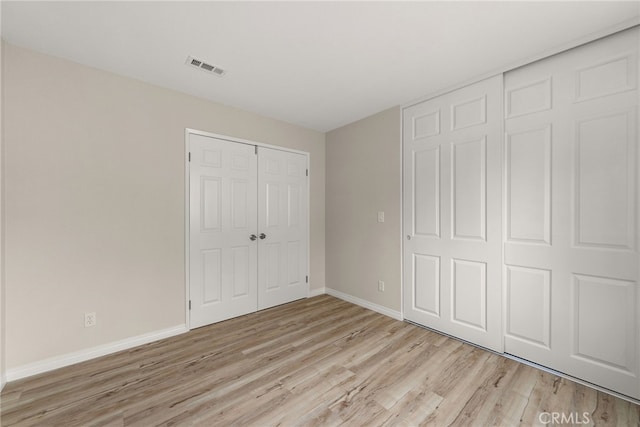 unfurnished bedroom featuring light hardwood / wood-style flooring