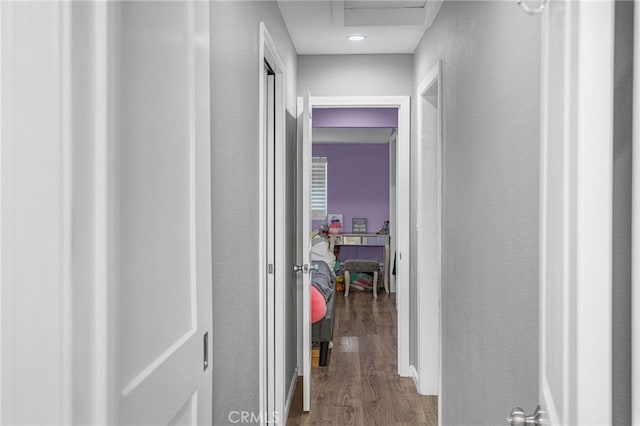 hallway featuring wood-type flooring