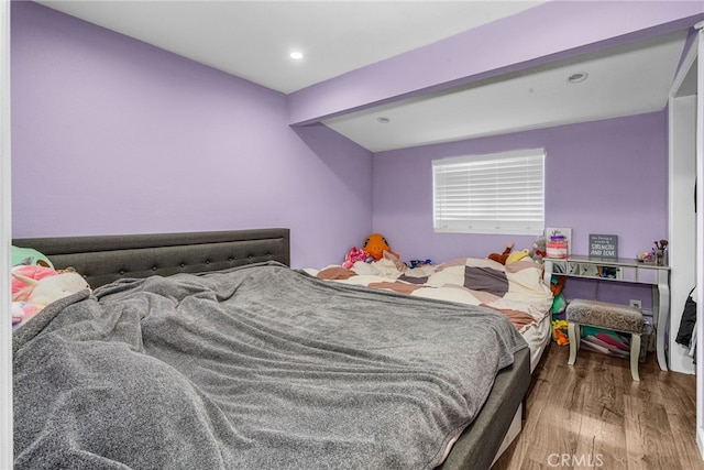 bedroom with wood-type flooring