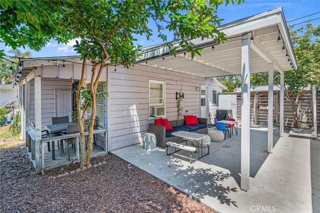 view of patio / terrace with an outdoor living space and cooling unit