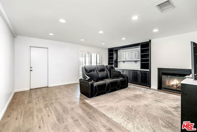 living room with light hardwood / wood-style flooring