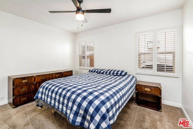 bedroom featuring ceiling fan and light carpet