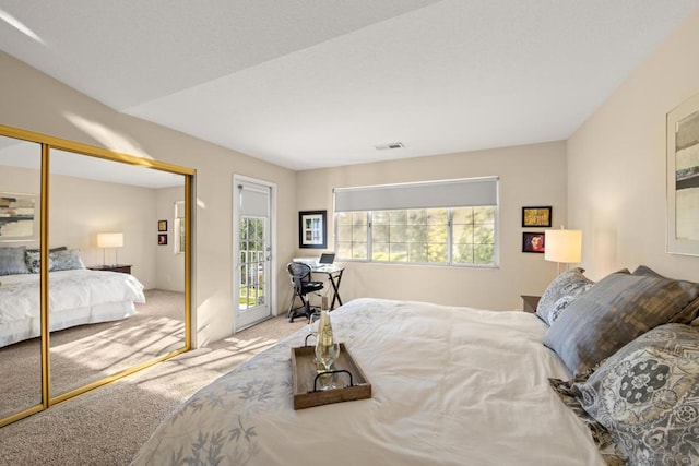 bedroom featuring carpet floors and a closet