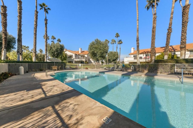 view of swimming pool with a patio area