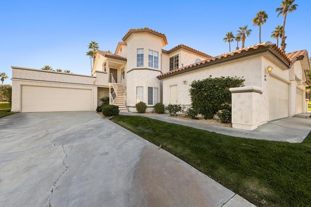 mediterranean / spanish-style home featuring a garage