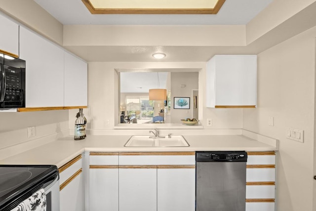 kitchen featuring sink, white cabinets, and black appliances