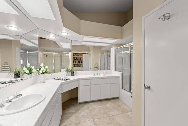 bathroom with vanity, tile patterned floors, and walk in shower