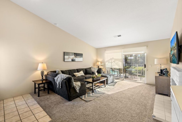 living room with light carpet and vaulted ceiling