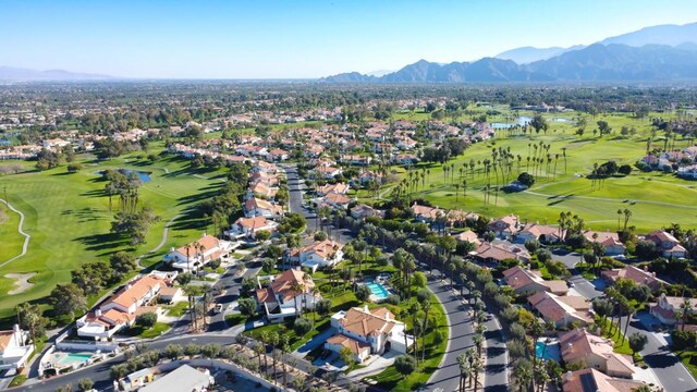 birds eye view of property featuring a mountain view