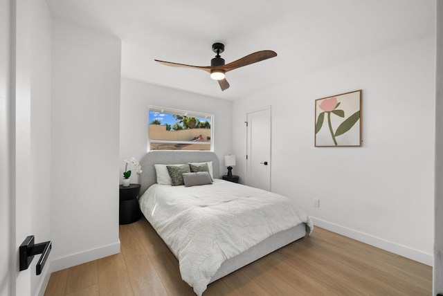 bedroom with ceiling fan and light hardwood / wood-style floors