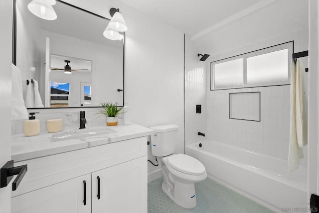 full bathroom with toilet, tiled shower / bath combo, ceiling fan, and vanity