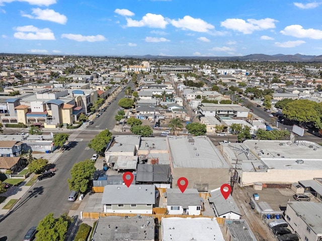 birds eye view of property featuring a mountain view