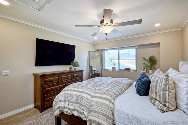 bedroom featuring ceiling fan, light wood-type flooring, and crown molding