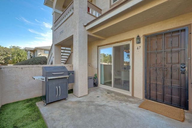 view of patio featuring a grill