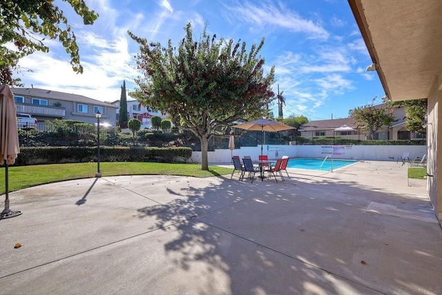 view of patio / terrace featuring a community pool