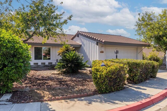 view of side of home featuring a garage