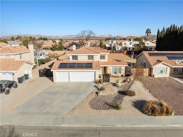 view of front of home featuring a mountain view and solar panels