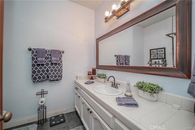 bathroom featuring vanity and baseboards