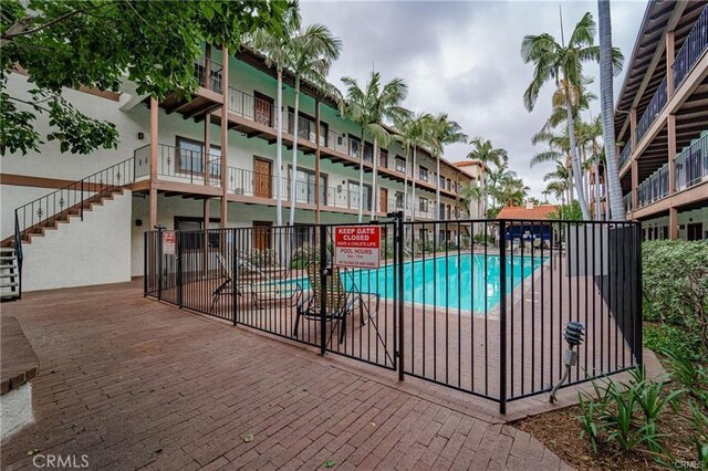 view of swimming pool with a patio area