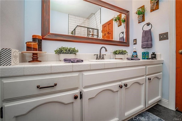 bathroom with a shower and vanity