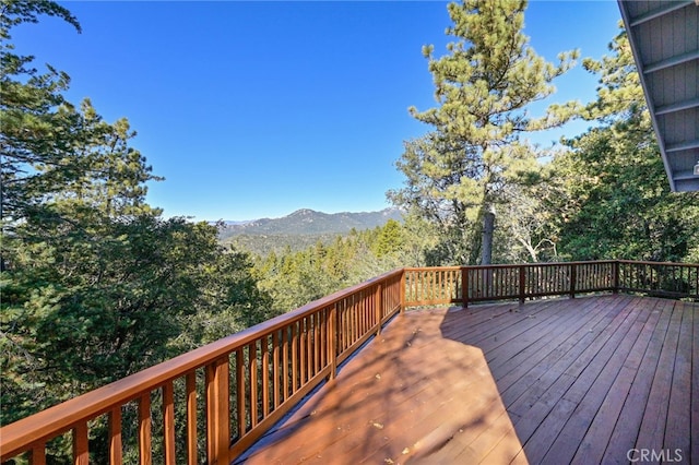 wooden terrace featuring a mountain view