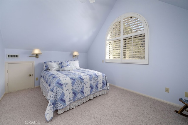 bedroom featuring light carpet and vaulted ceiling