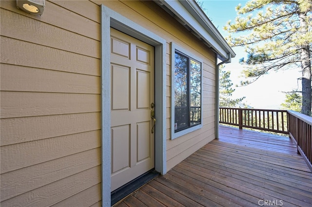 doorway to property with a deck