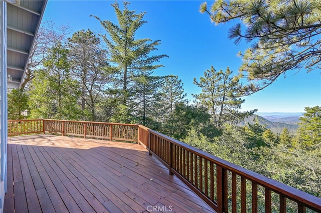 wooden terrace with a mountain view