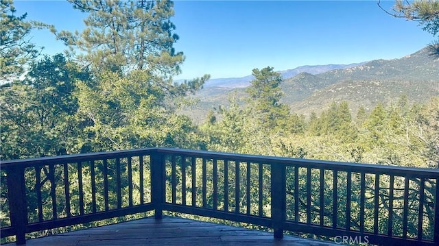 wooden terrace with a mountain view