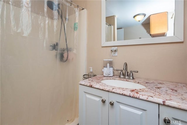 bathroom with vanity and a shower with curtain