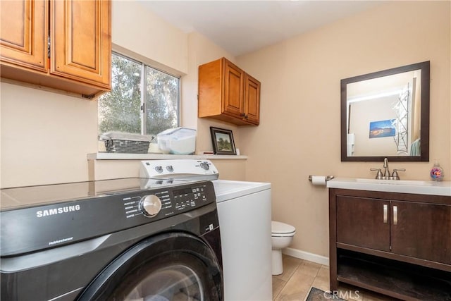 laundry room featuring sink and washer / dryer