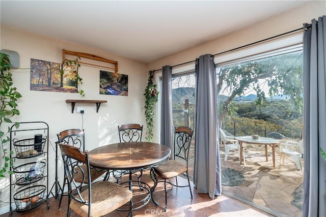 dining area with hardwood / wood-style floors