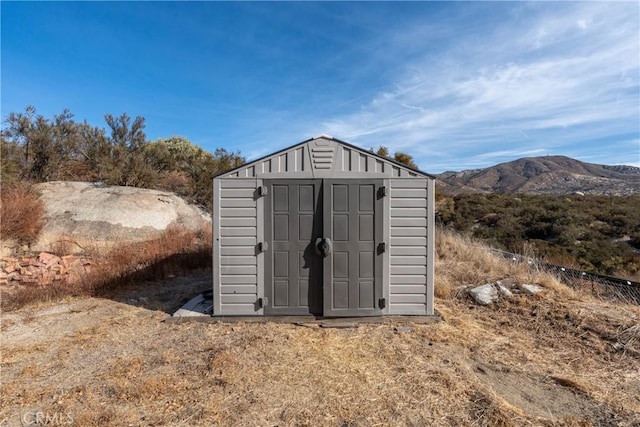 view of outdoor structure with a mountain view