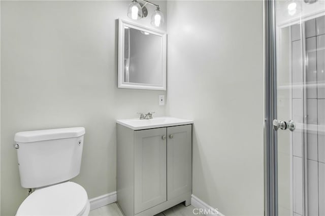 bathroom with tile patterned floors, toilet, and vanity