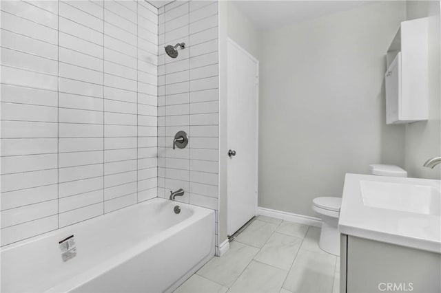 full bathroom featuring tiled shower / bath combo, vanity, and toilet