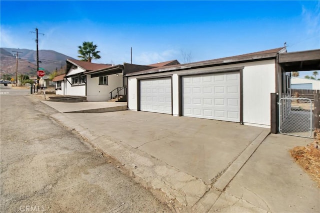 garage featuring a mountain view