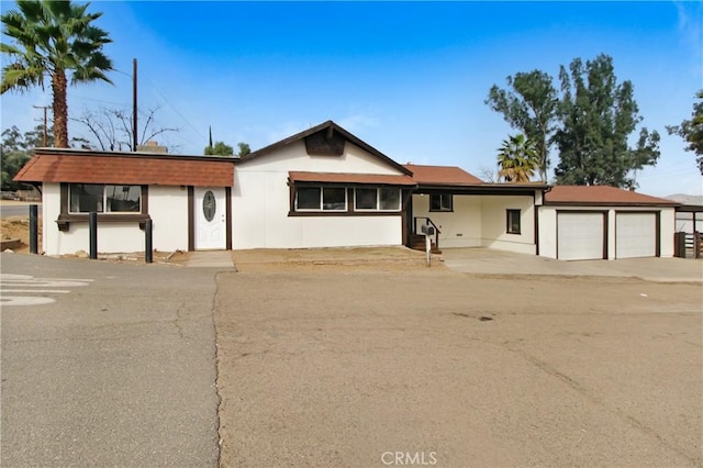 ranch-style house featuring a garage