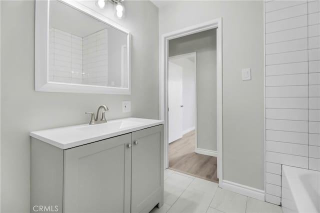 bathroom with tile patterned floors, vanity, and bathing tub / shower combination