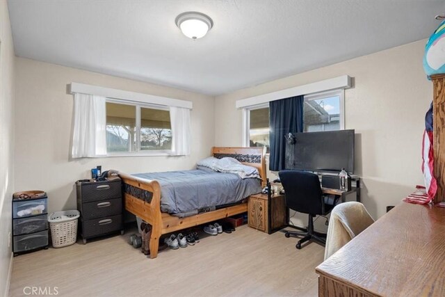 bedroom with light hardwood / wood-style flooring