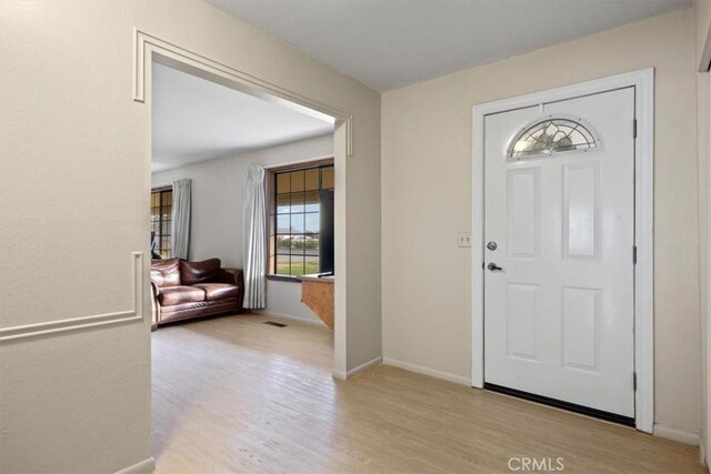 foyer with light wood-type flooring