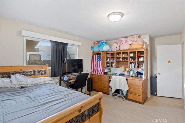 bedroom with light hardwood / wood-style flooring