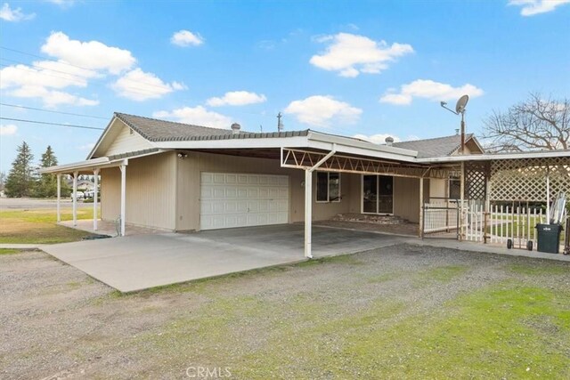 rear view of house with a garage