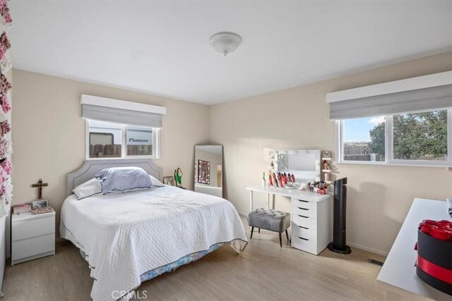 bedroom with light hardwood / wood-style floors