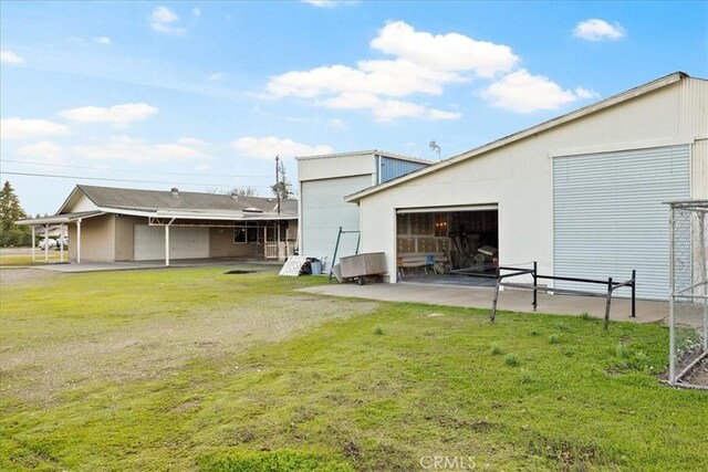 exterior space featuring a yard and an outbuilding