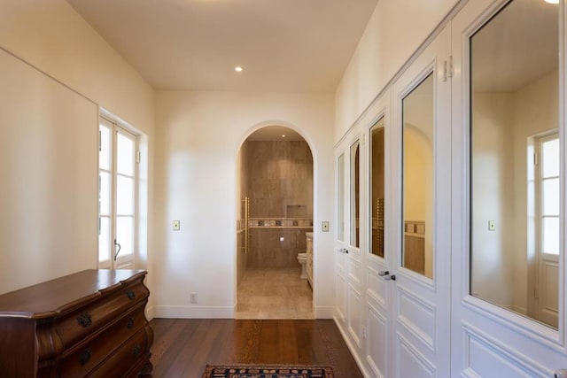 hallway featuring hardwood / wood-style flooring and plenty of natural light