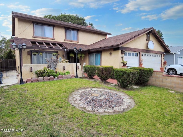 front of property featuring a front lawn and a garage