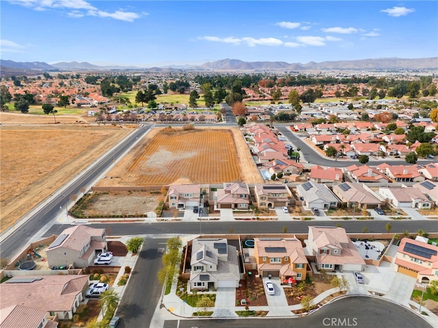 birds eye view of property with a mountain view