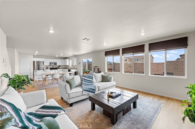 living room with light wood-type flooring