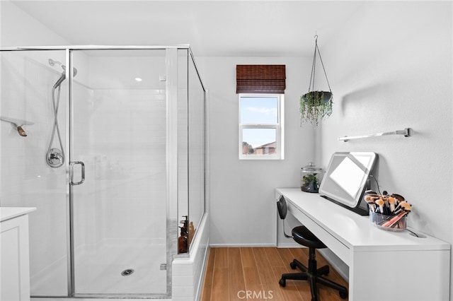 bathroom with a shower with door